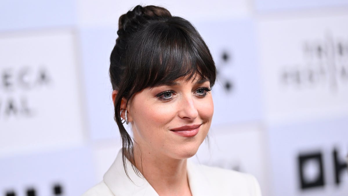 Dakota Johnson says the Fifty Shades Of Grey filming process was "a battle" and "so, so weird"