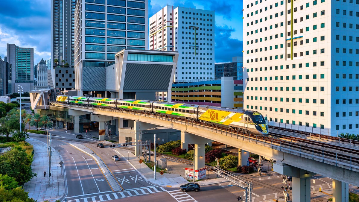 Florida’s private owned Brightline passenger train pulled a test engine into its new terminal station at Orlando International Airport on Tuesday. T