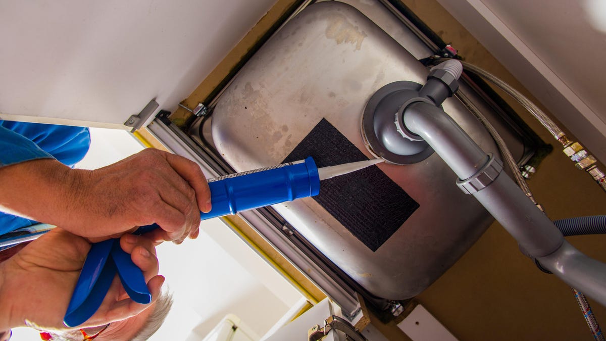 How to Fill Holes Around the Pipes Under Your Kitchen Sink thumbnail