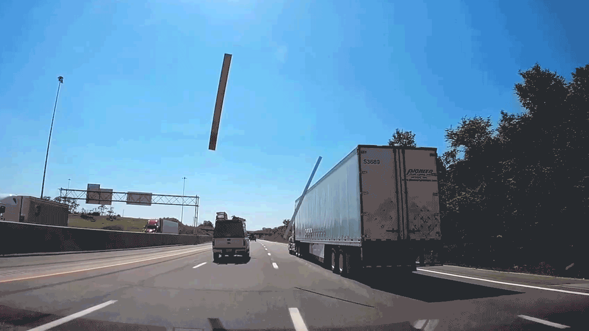 Wooden Plank Falls Off Truck Hits Windshield Of Following Car