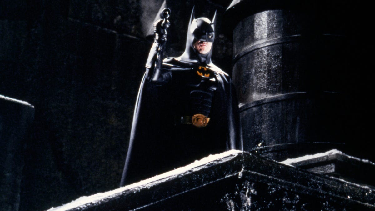 The flash begins with the production of Michael Keaton’s Batman