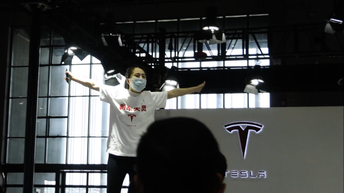 A Tesla protester has been removed from the Shanghai Motor Show