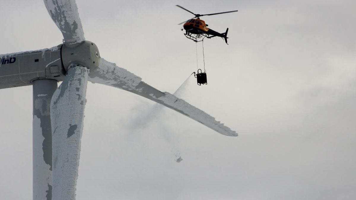 Viral Image of Helicopter De-Icing Texas Wind Turbine From 2016