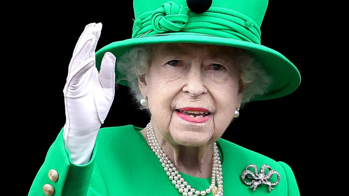 Deceased Queen Elizabeth Continues To Wave At Subjects As Maggots Writhe Inside Corpse