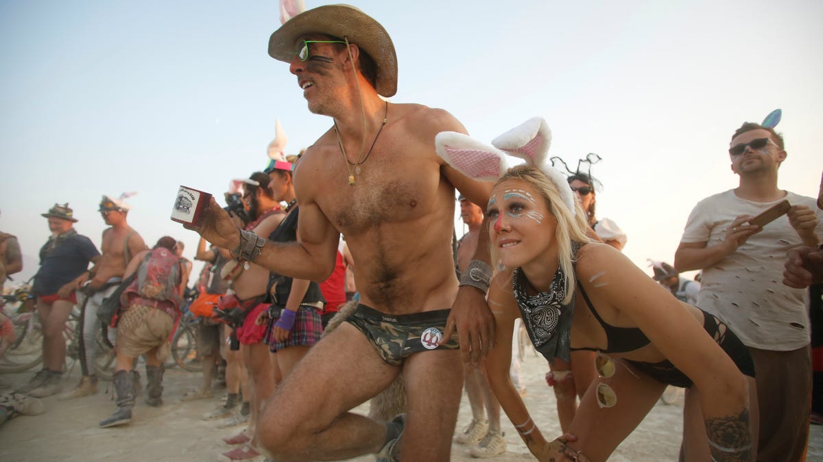 Who attends Burning Man?