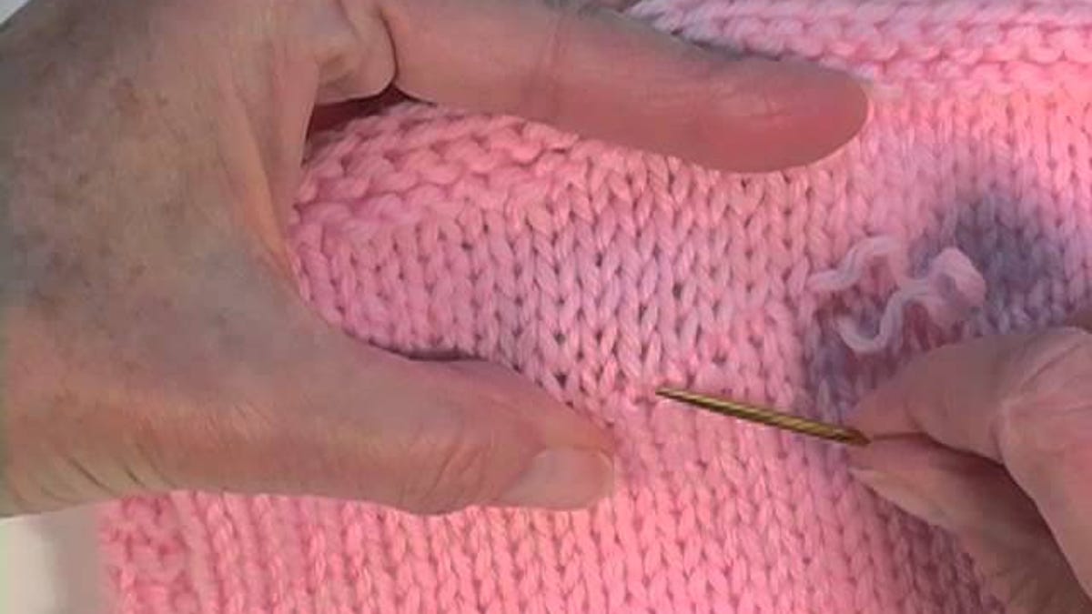 Fix A Snagged Sweater By Pulling The Yarn Back In