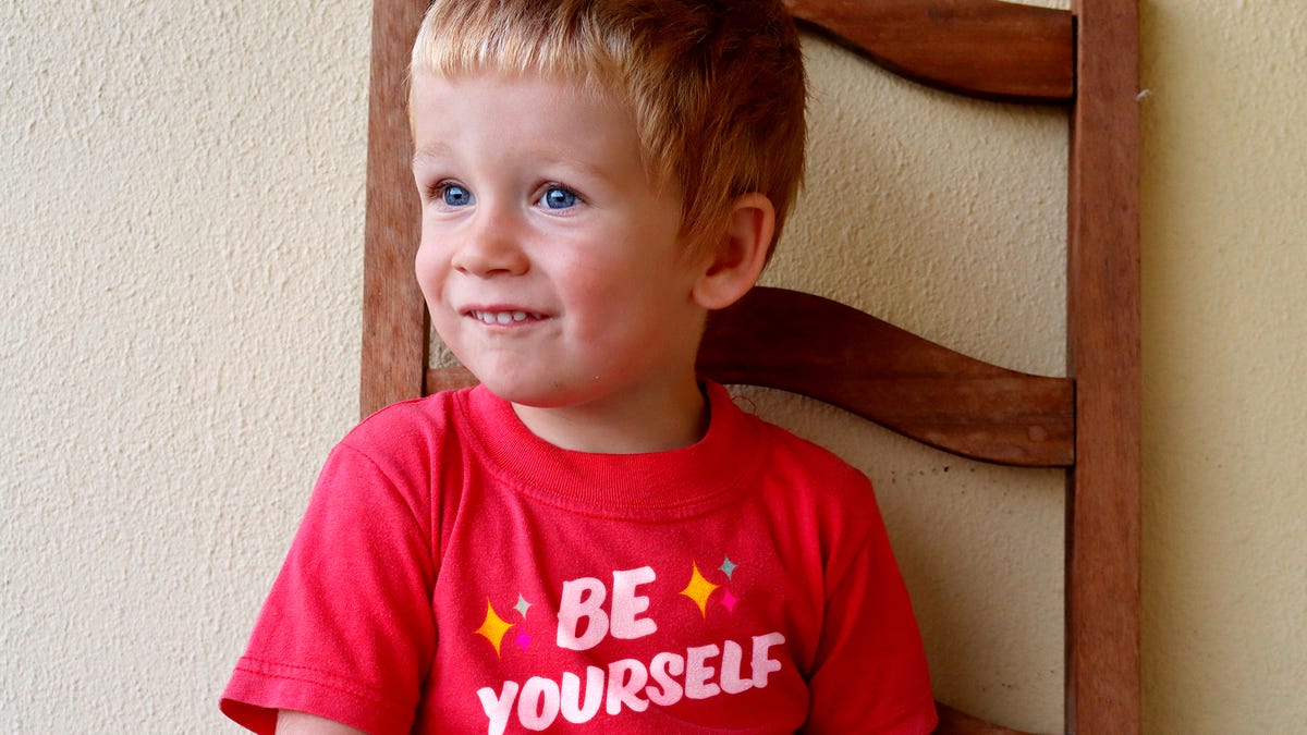 Child Not Quite Confident Enough To Pull Off ‘Be Yourself’ Shirt - the onion
