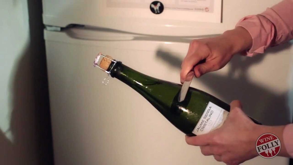 Saber A Champagne Bottle With A Spoon
