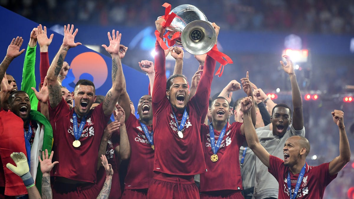  Liverpool's defense celebrates winning the Champions League after overcoming setpiece vulnerability.