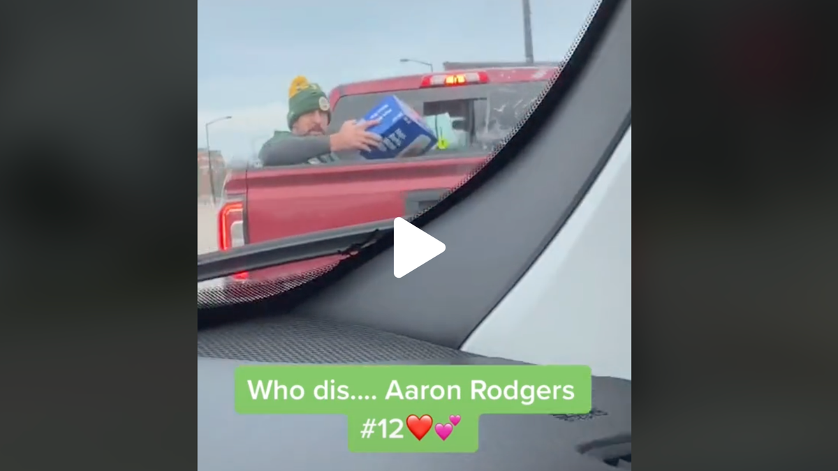 Yes, that's Aaron Rodgers with a case of cold ones in back of a pickup & he doesn't care what you think