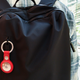 An Apple AirTag attached to a backpack
