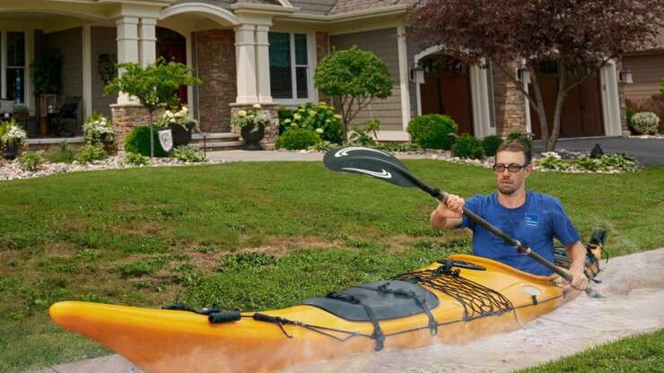 Image for Weather Channel Correspondent Paddling Boat Through Melted Sidewalk To Show Off Extent Of Heat Wave