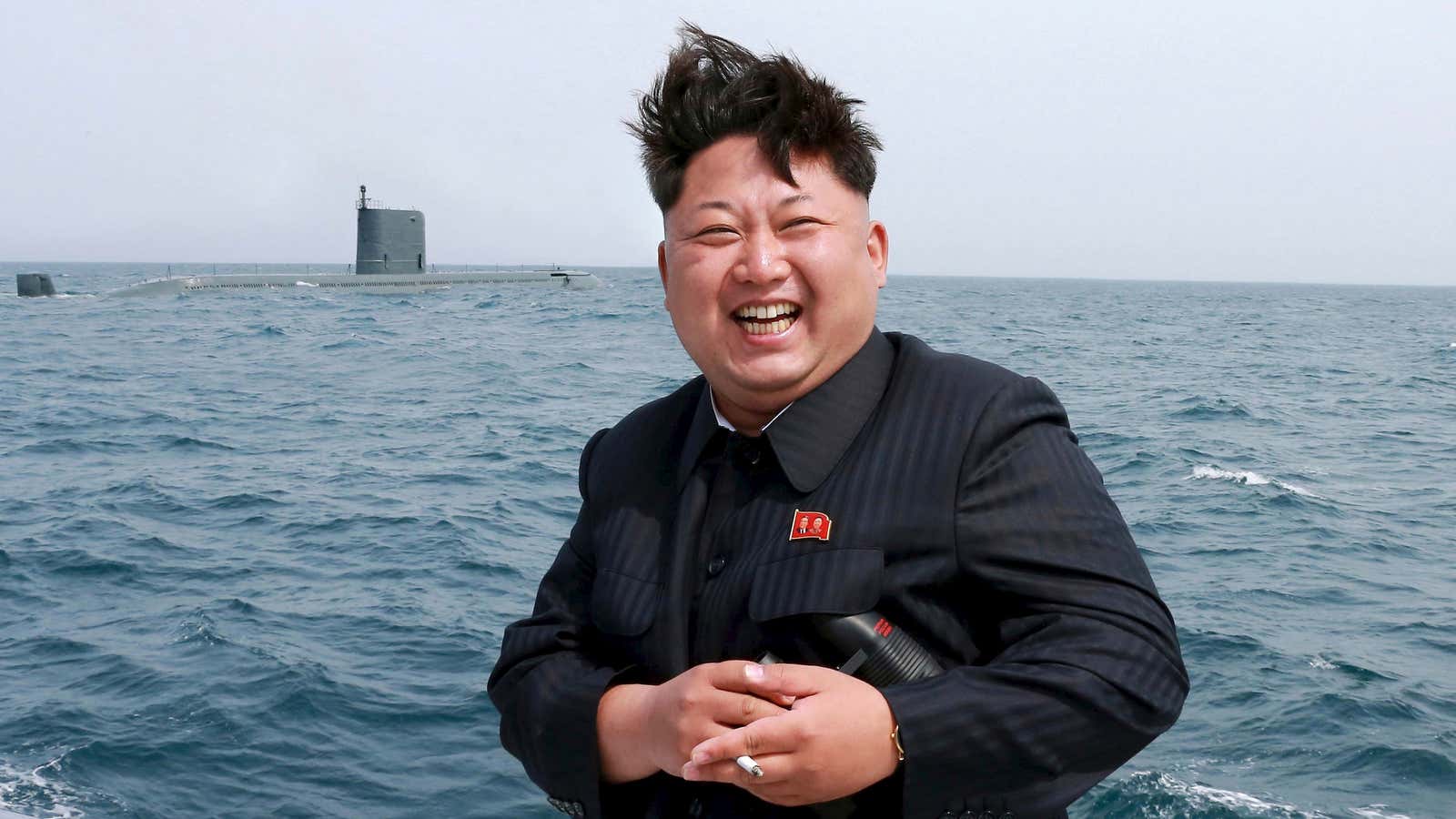 Kim Jong Un poses at a purported test-fire of a strategic submarine underwater ballistic missile.