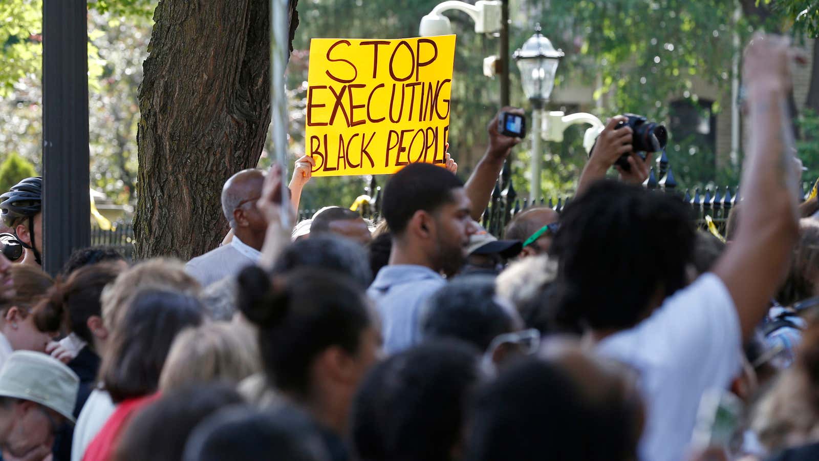 Protesters gather outside the governor’s residence in St. Paul, Minnesota, to protest the shooting death by police of Philando Castile.