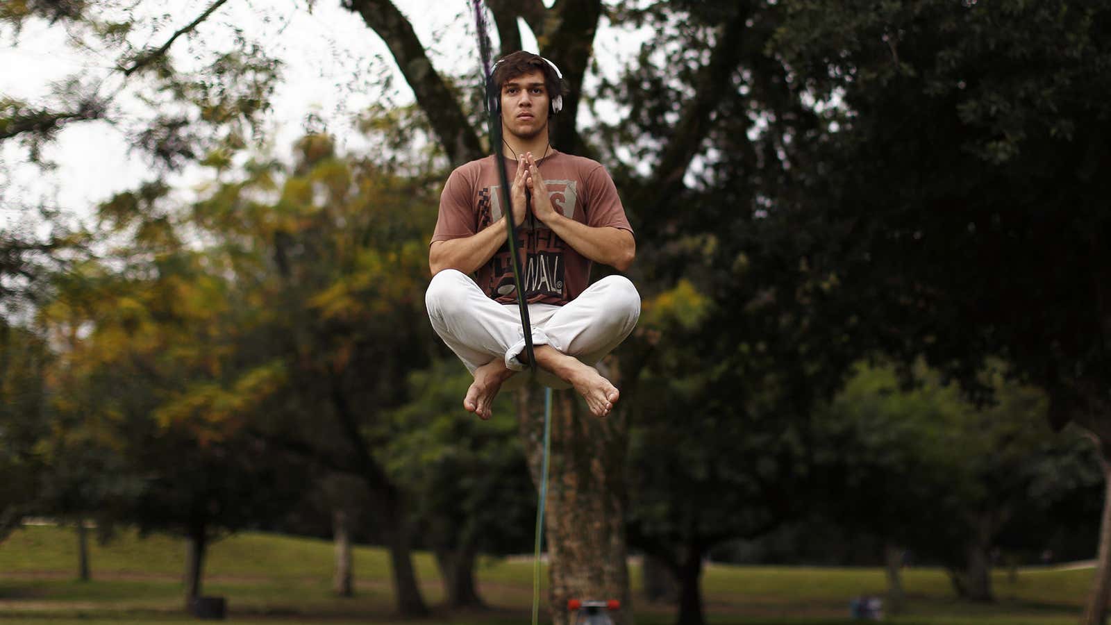 Vitor Haas concentrates as he sits on a rope before tightrope walking near the Beira-Rio stadium in Porto Alegre June 16, 2014. In a project…