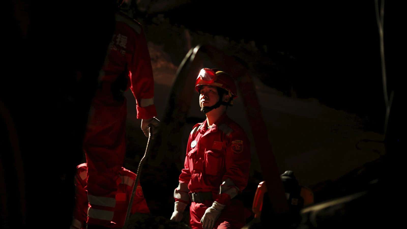 A Chinese rescue worker in a collapsed hotel in Kathmandu.
