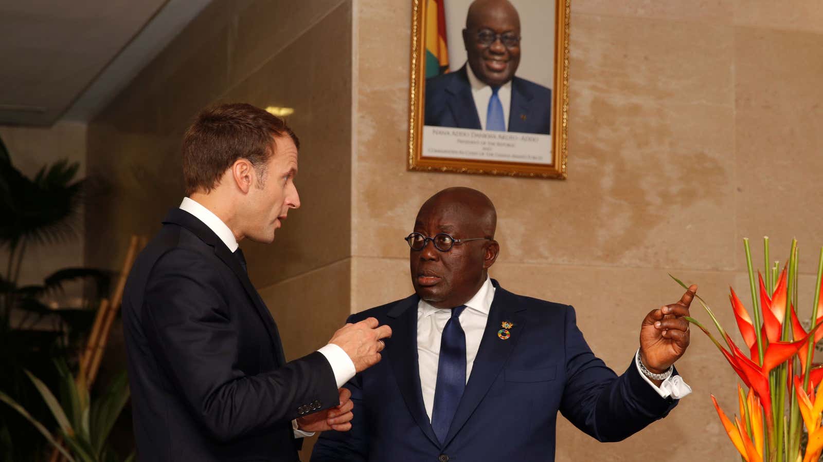 French President Emmanuel Macron speaks with Ghana’s President Nana Akufo-Addo