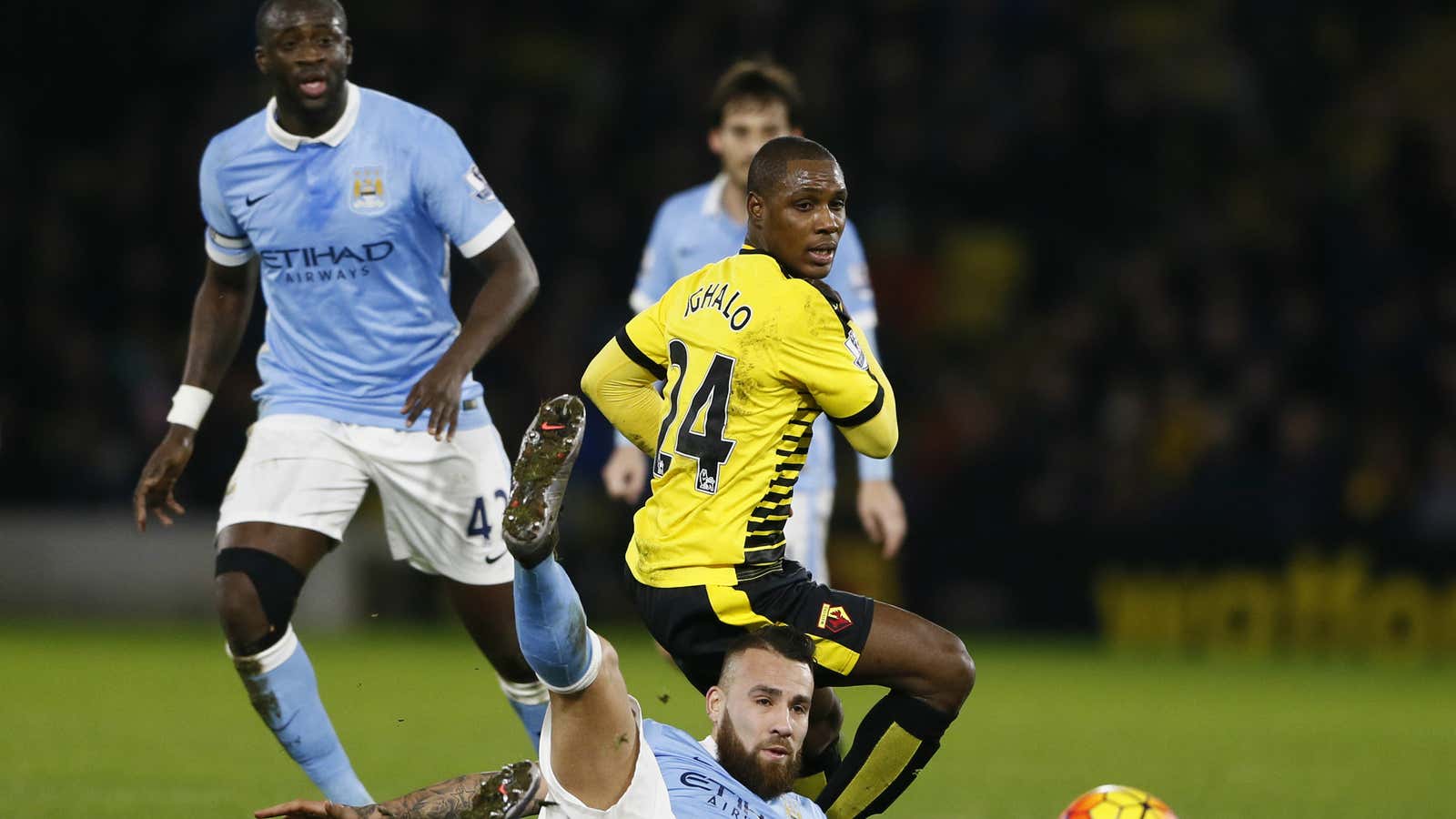 Manchester City’s Yaya Toure looks on Watford’s Odion Ighalo takes on his teammate. They are two of the EPL’s African star players.
