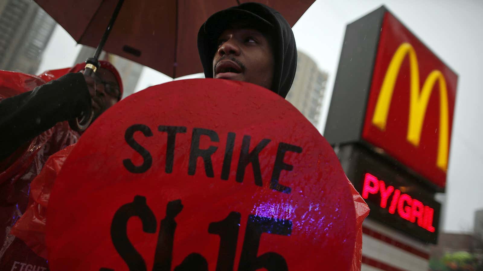 Demonstrators protest for higher wages in front of a McDonald’s restaurant in Chicago.