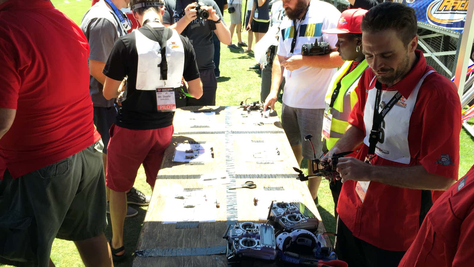 Winner Nowak (right) prepares his drone for his last race.