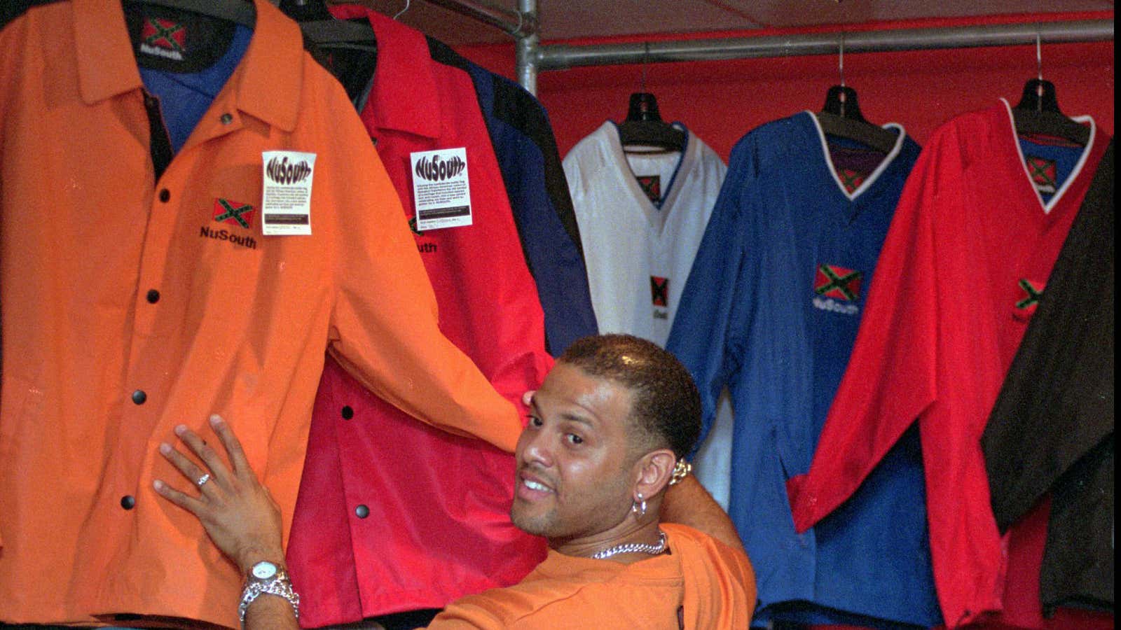 NuSouth co-founder Angel Quintero, pictured in 1999, looks through a rack of jackets in the brand’s Charleston, SC store.