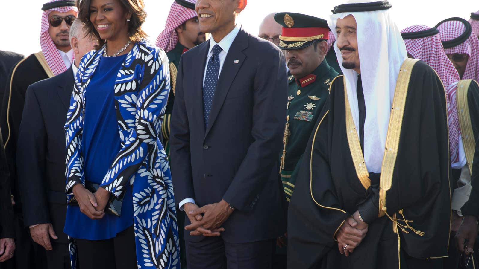President Barack Obama and first lady Michelle Obama stand with new Saudi King Salman bin Abdul Aziz, heads uncovered.