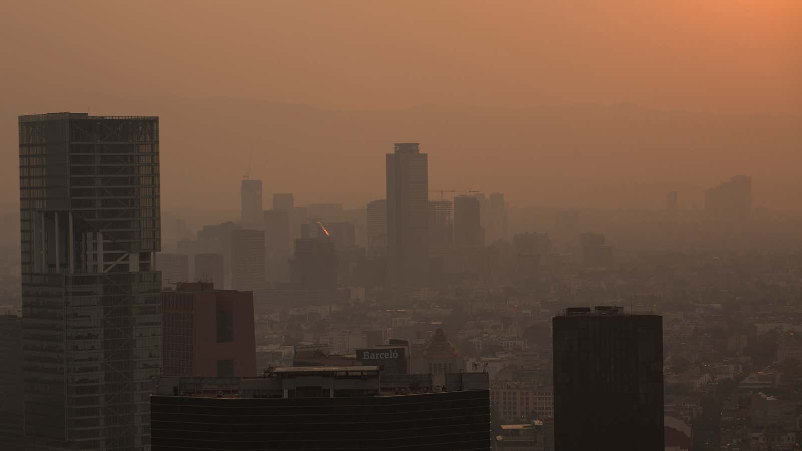 The sunset illuminates the haze as seen from the Latin American Tower on May 14.