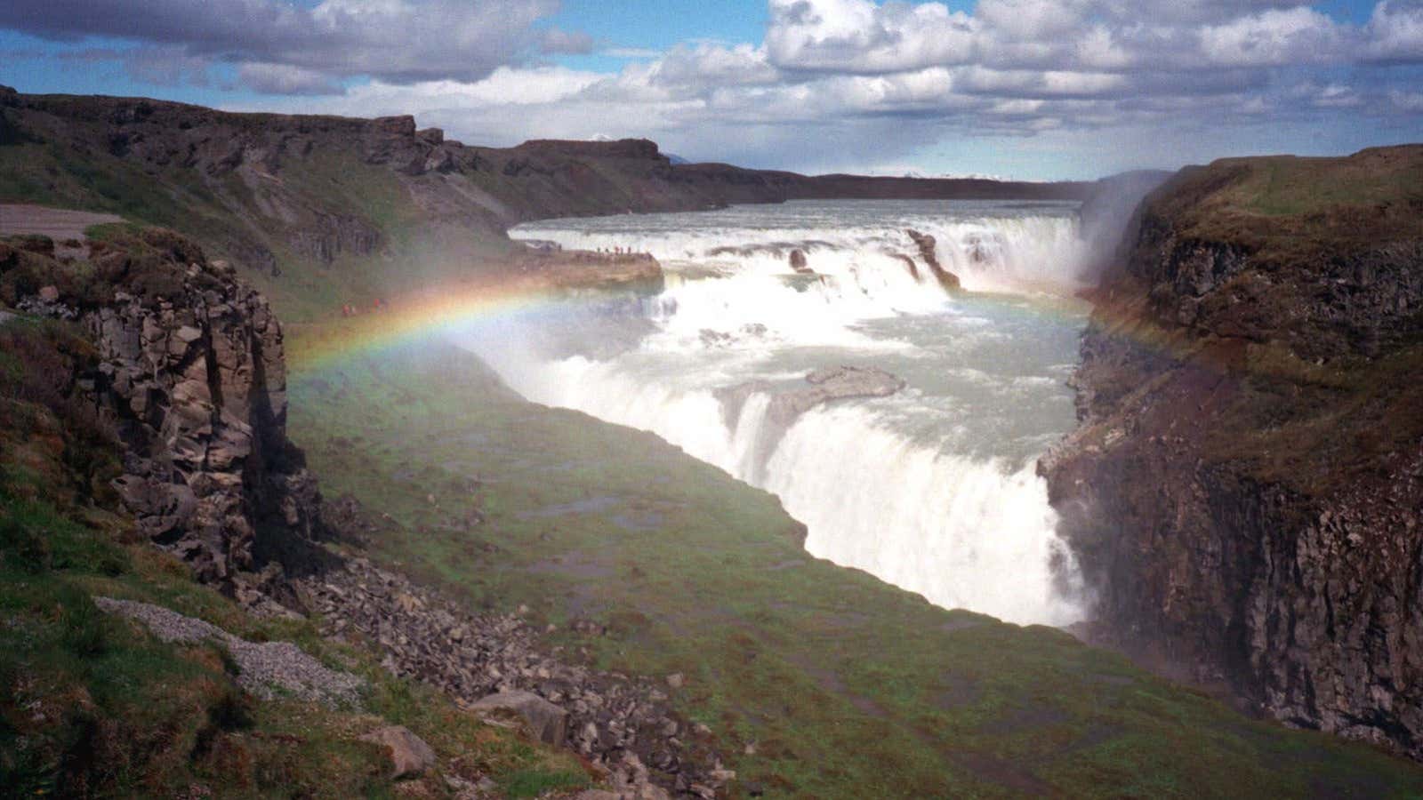 Droves of visitors descend upon Iceland’s Gullfoss waterfall during peak tourist season.