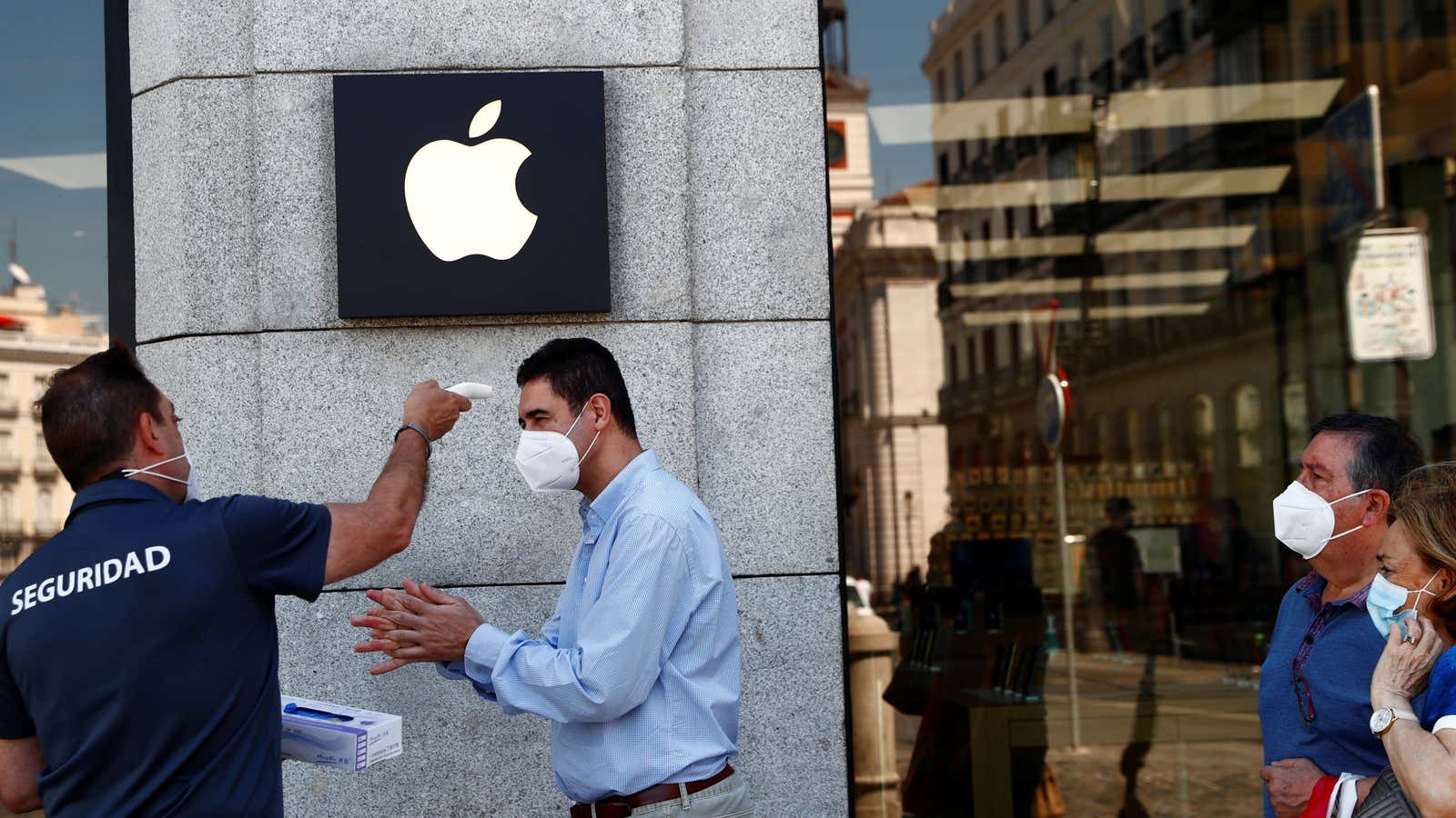 A man wearing a protective mask gets his temperature taken before entering an Apple store, amid the coronavirus disease (COVID-19) outbreak, in Madrid, Spain last…