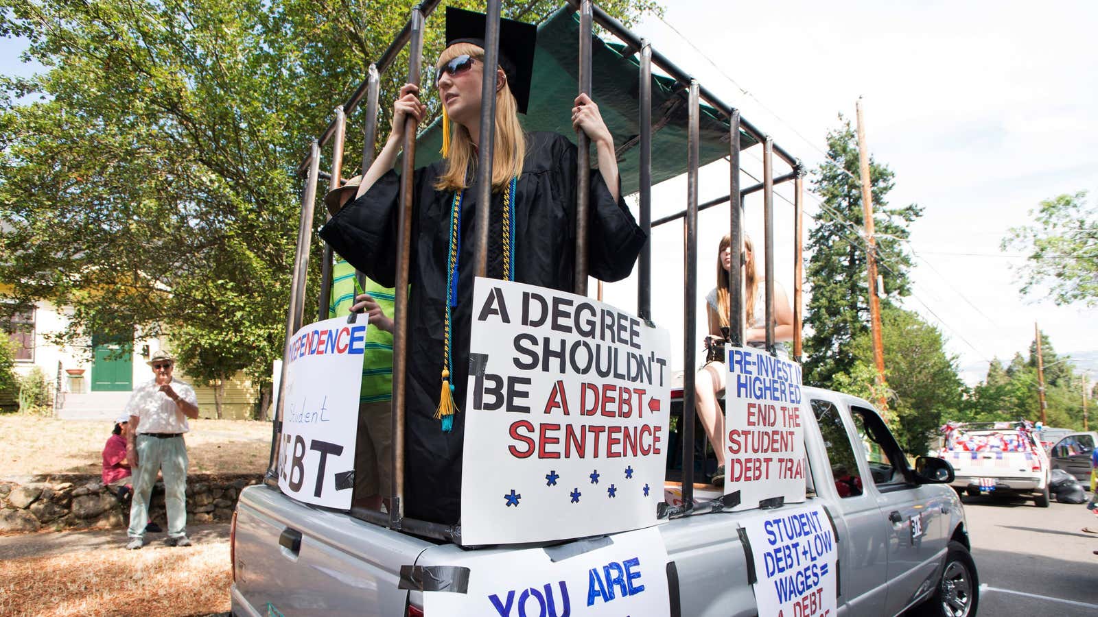 Parade participants protesting against high student loan burdens