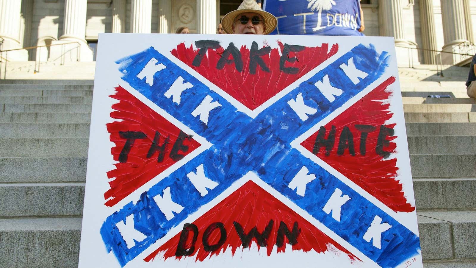 A protester calls for the Confederate flag in South Carolina’s state capitol to be taken down.