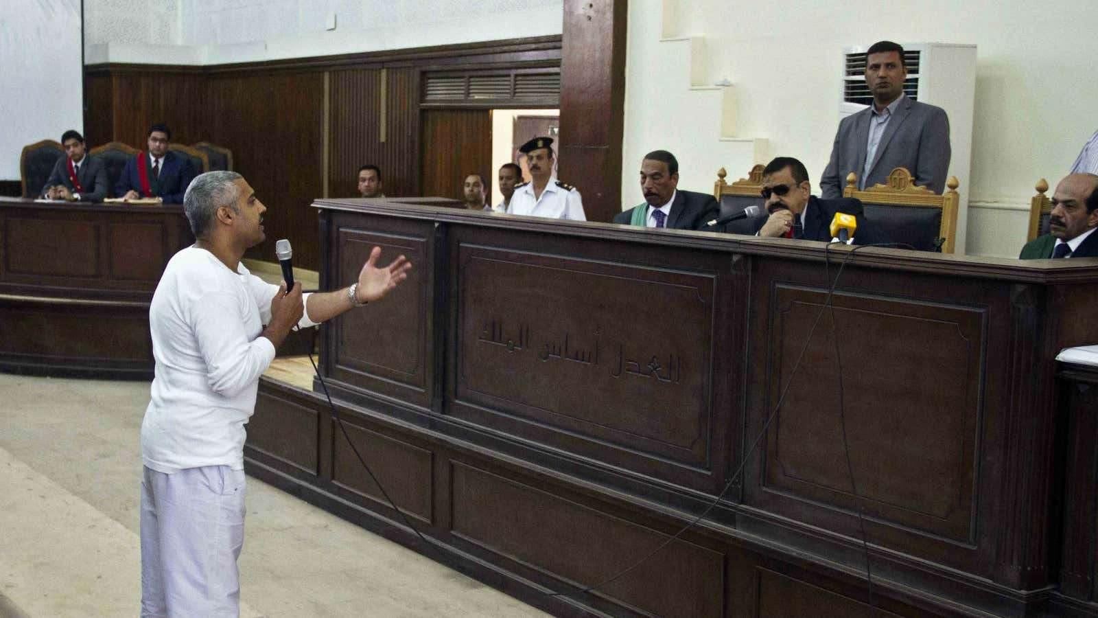Mohammed Fahmy talks to the judge in a courthouse near Tora prison.
