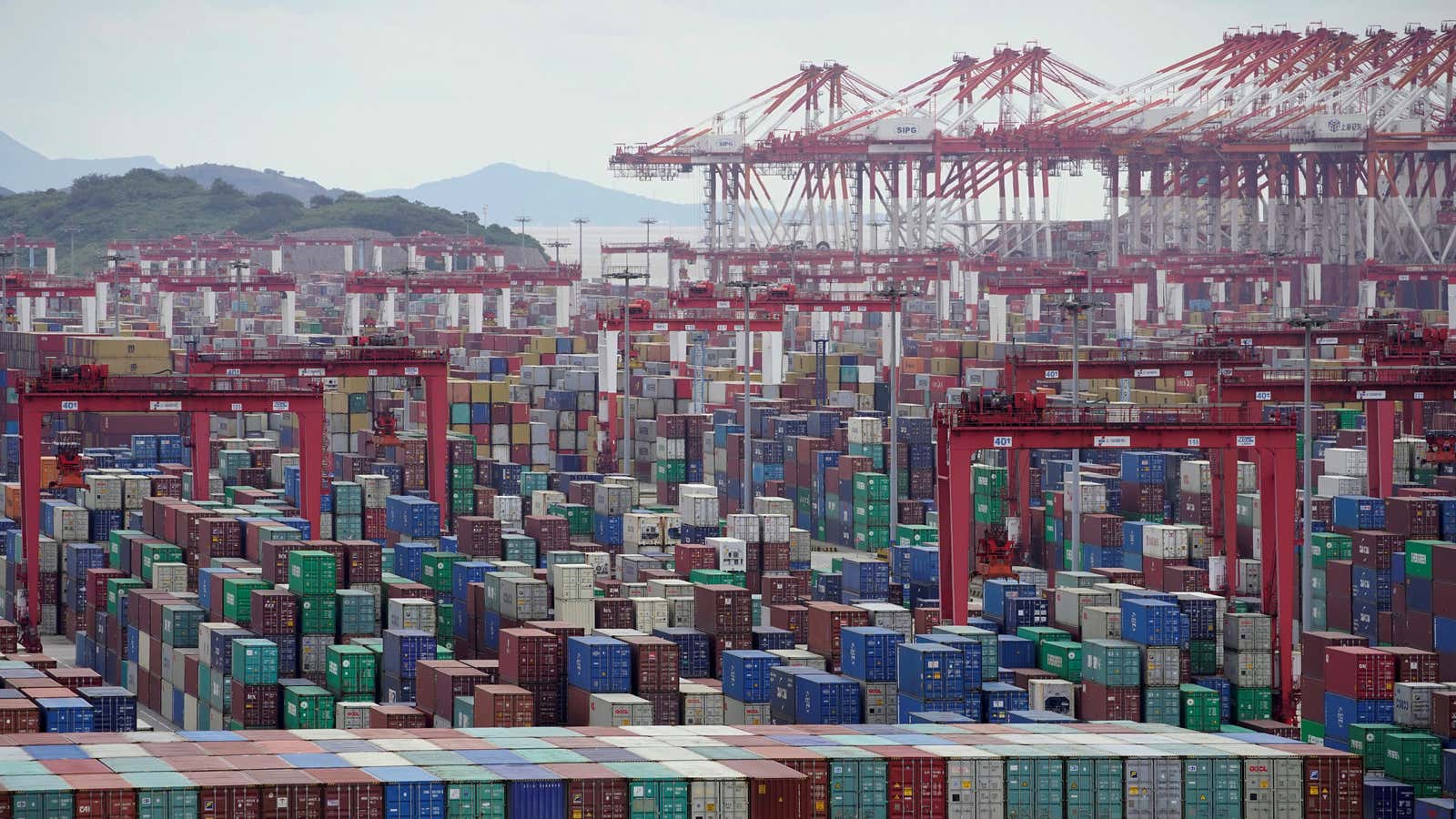 A sea of containers is piled up at the Port of Shanghai.