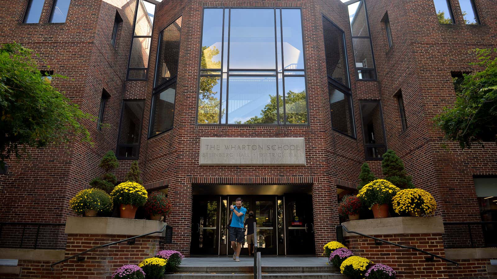 A student leaves the Wharton School of Business on the campus of the University of Pennsylvania in Philadelphia, Pennsylvania, U.S., September 25, 2017.