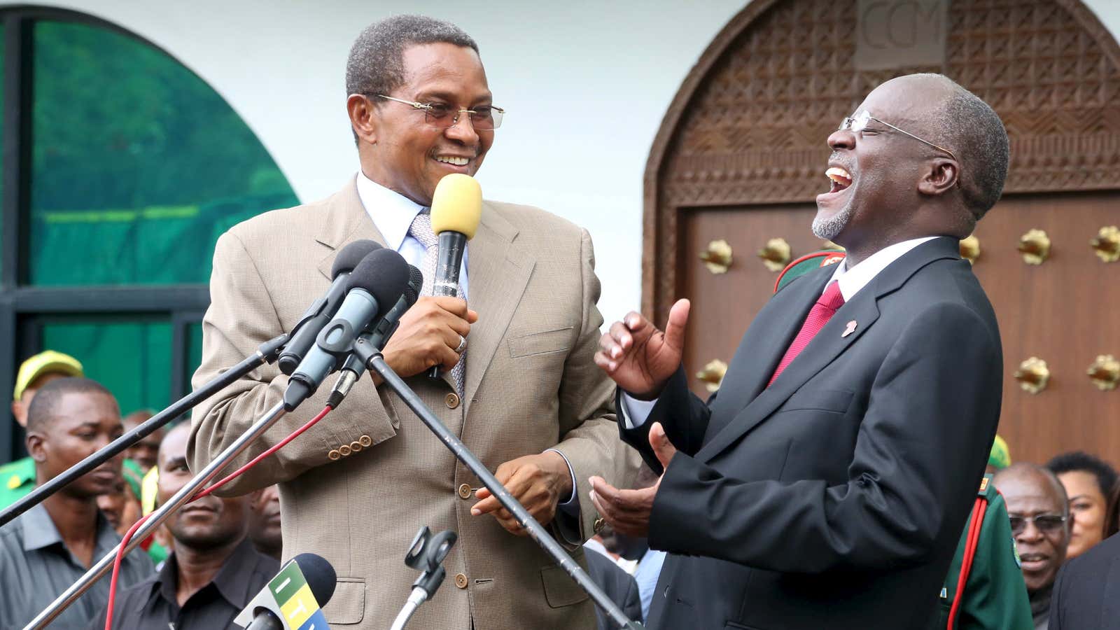 Not all jokes get President Magufuli (right) laughing.
