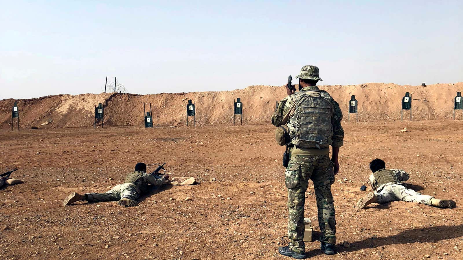 A US soldier trains Syrian opposition fighters.