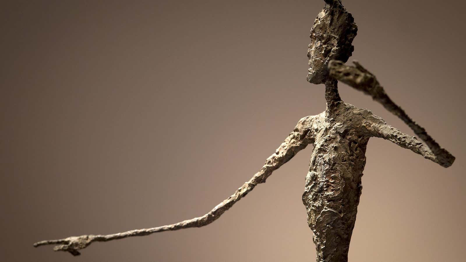 Alberto Giacometti’s sculpture “L’homme Au Doigt” (Pointing man).