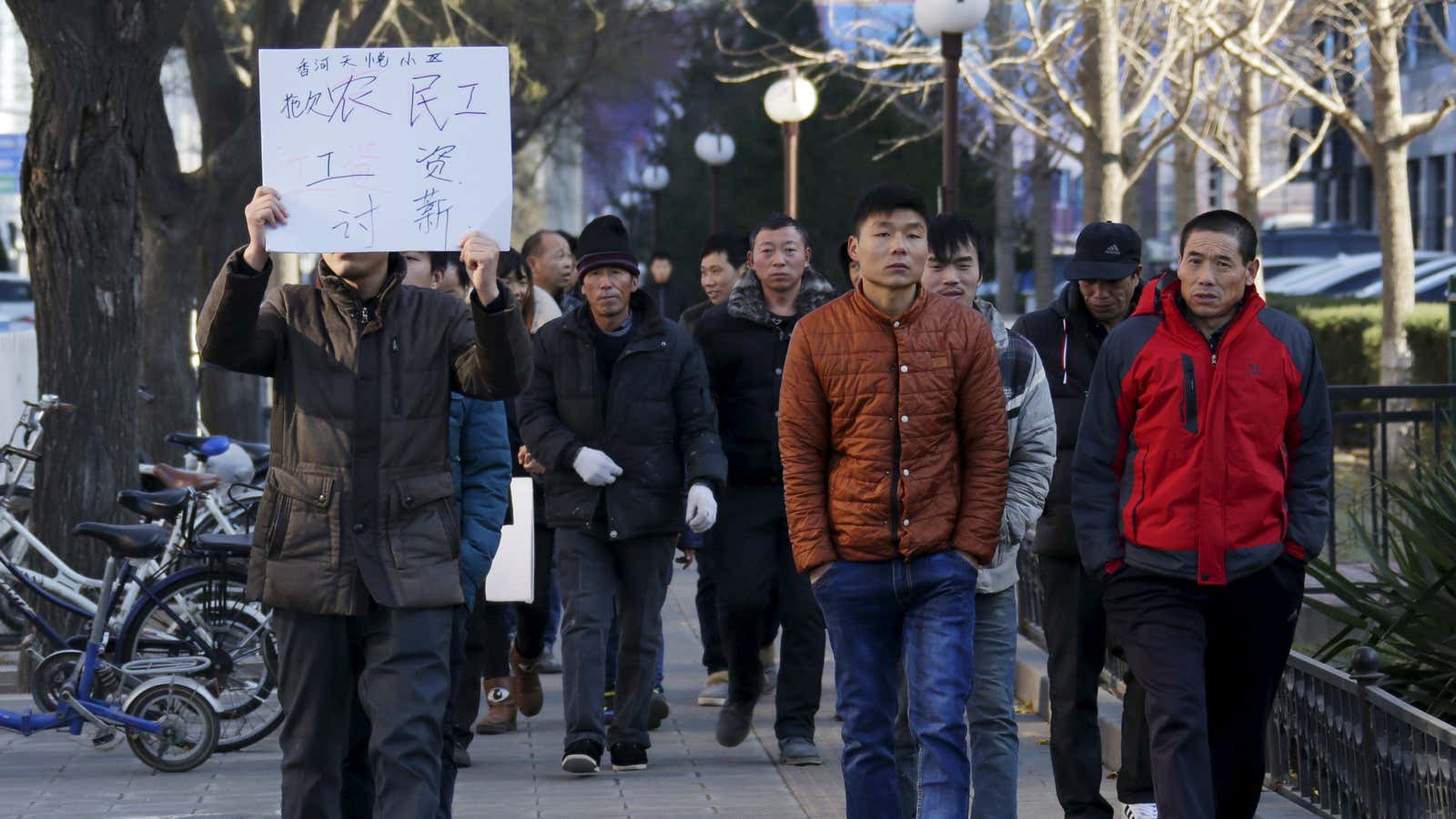 Dozens of migrant workers protest to demand their salaries in Beijing in December, 2015.