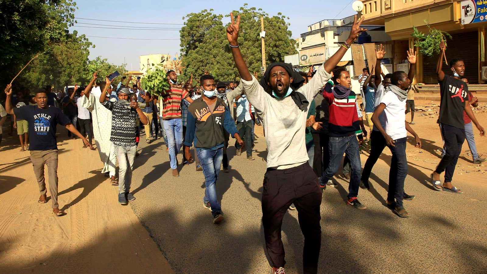 Anti-government Sudanese demonstrators chant slogans in Khartoum, Sudan.