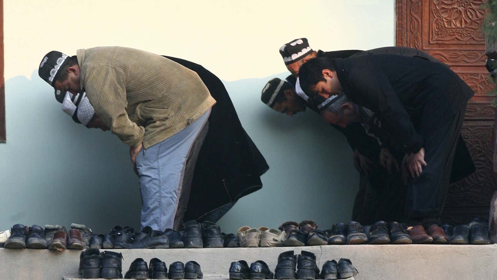 Men pray at a mosque in the village of Nurabad, some 40 km (25 miles) west of the Tajik capital, Dushanbe.