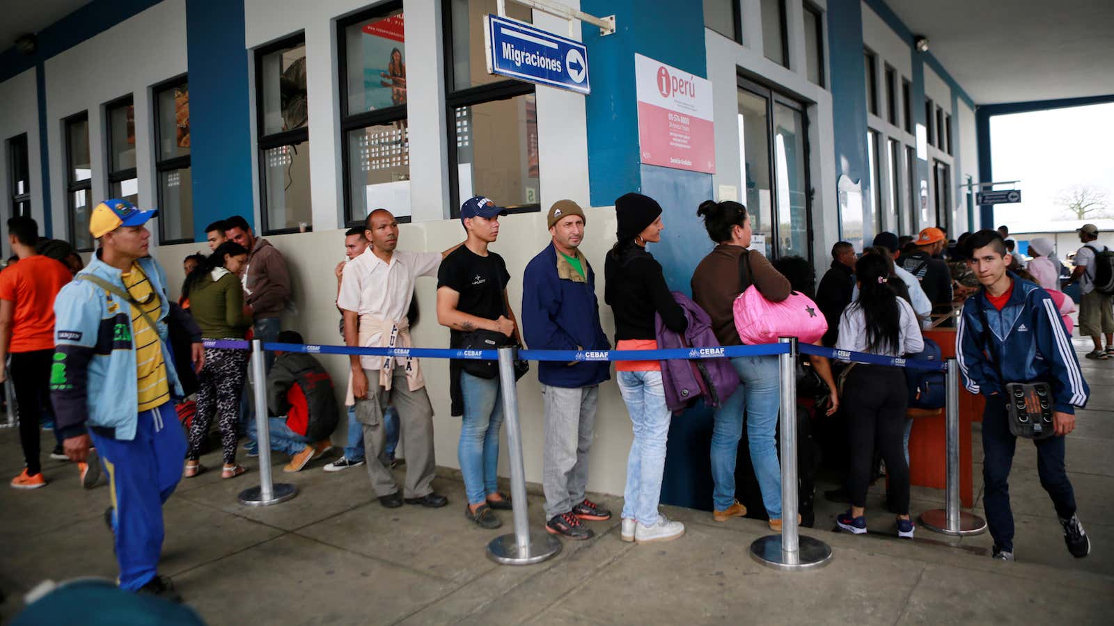 Venezuelan migrants cross from Ecuador to Peru.