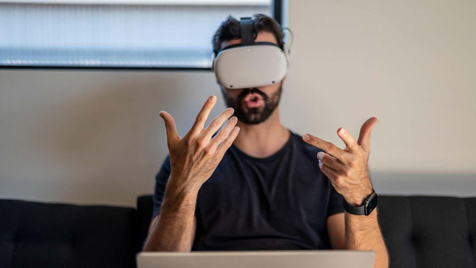 A user wearing the Meta Quest 2 virtual reality headset. 