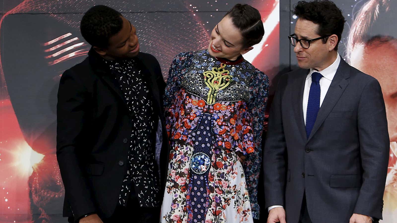 Director J.J. Abrams (right), with John Boyega and Daisy Ridley.