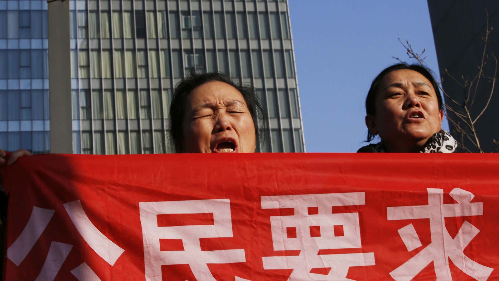 Protesters at the trial of Chinese activist Xu Zhiyong.