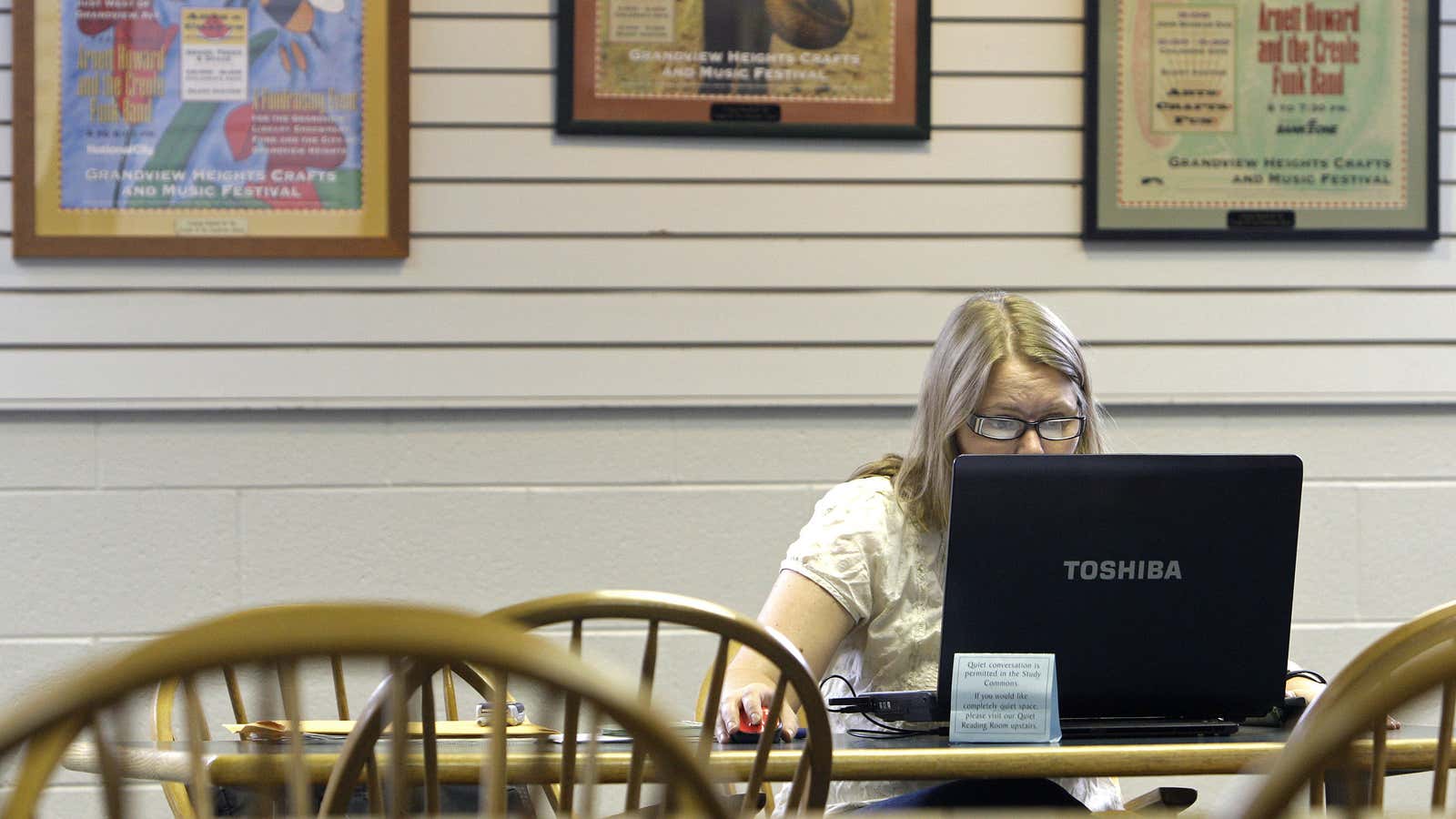 Ohio State student Lindsey Long, of Hilliard, uses the wi-fi connection at Grandview Heights Public Library Wednesday, Sept. 1, 2010, in Grandview Heights, Ohio. Long…