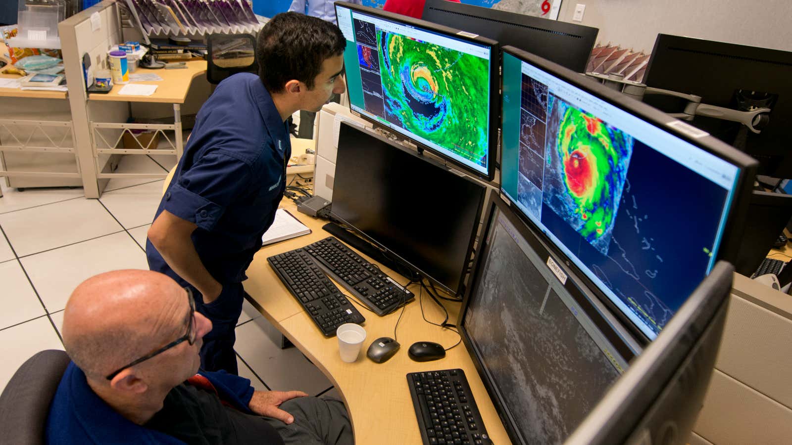 Specialists at the National Hurricane Center in Miami monitor Hurricane Irma.