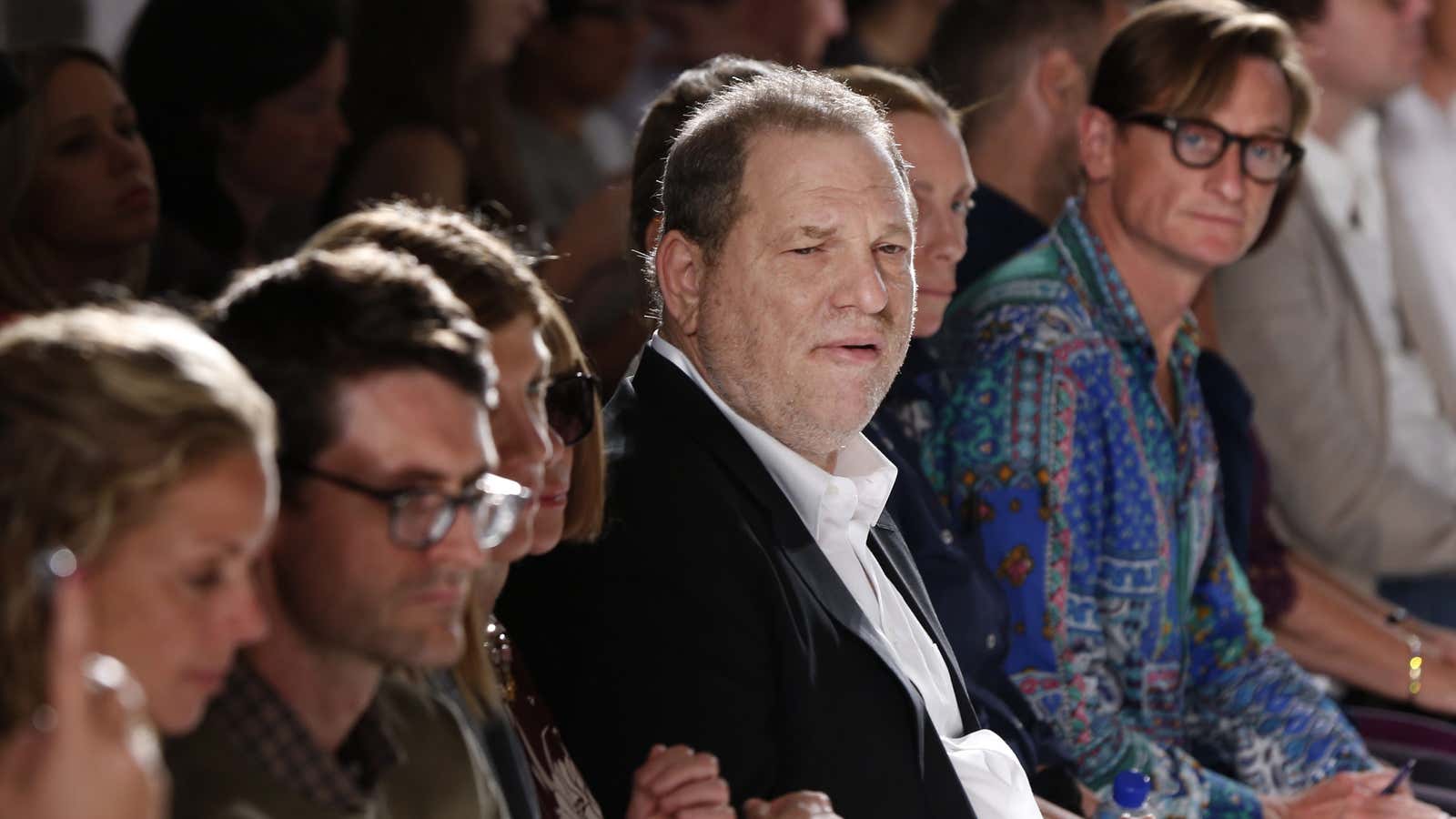Harvey Weinstein watches the models at the Marchesa spring-summer 2014 runway show.