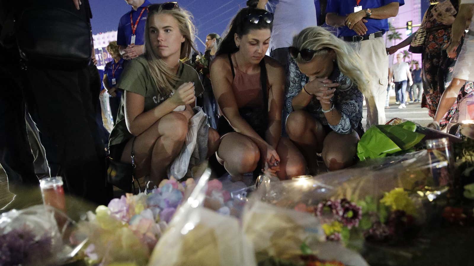 People mourn the dozens killed by Paddock.