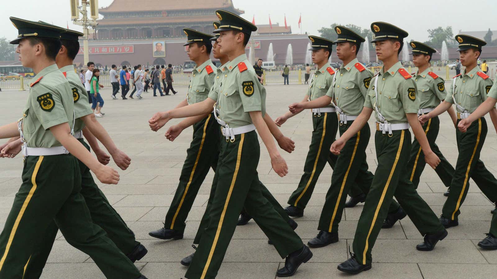 Police officers guard Tiananmen Square in Beijing on Sunday.
