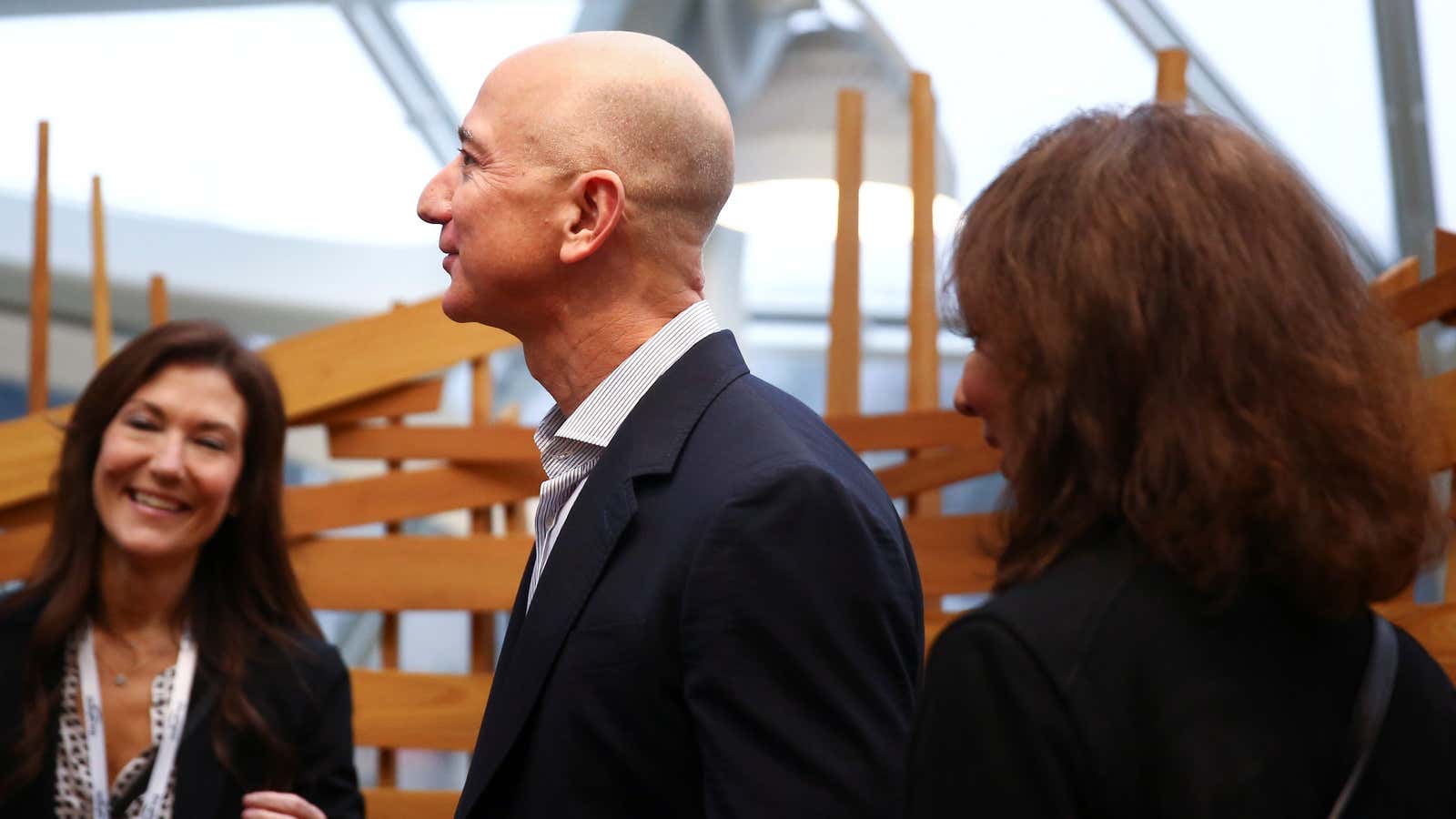 Amazon founder and CEO Jeff Bezos stands in the “bird cage” structure as he gets a tour of the new Amazon Spheres opening event at…